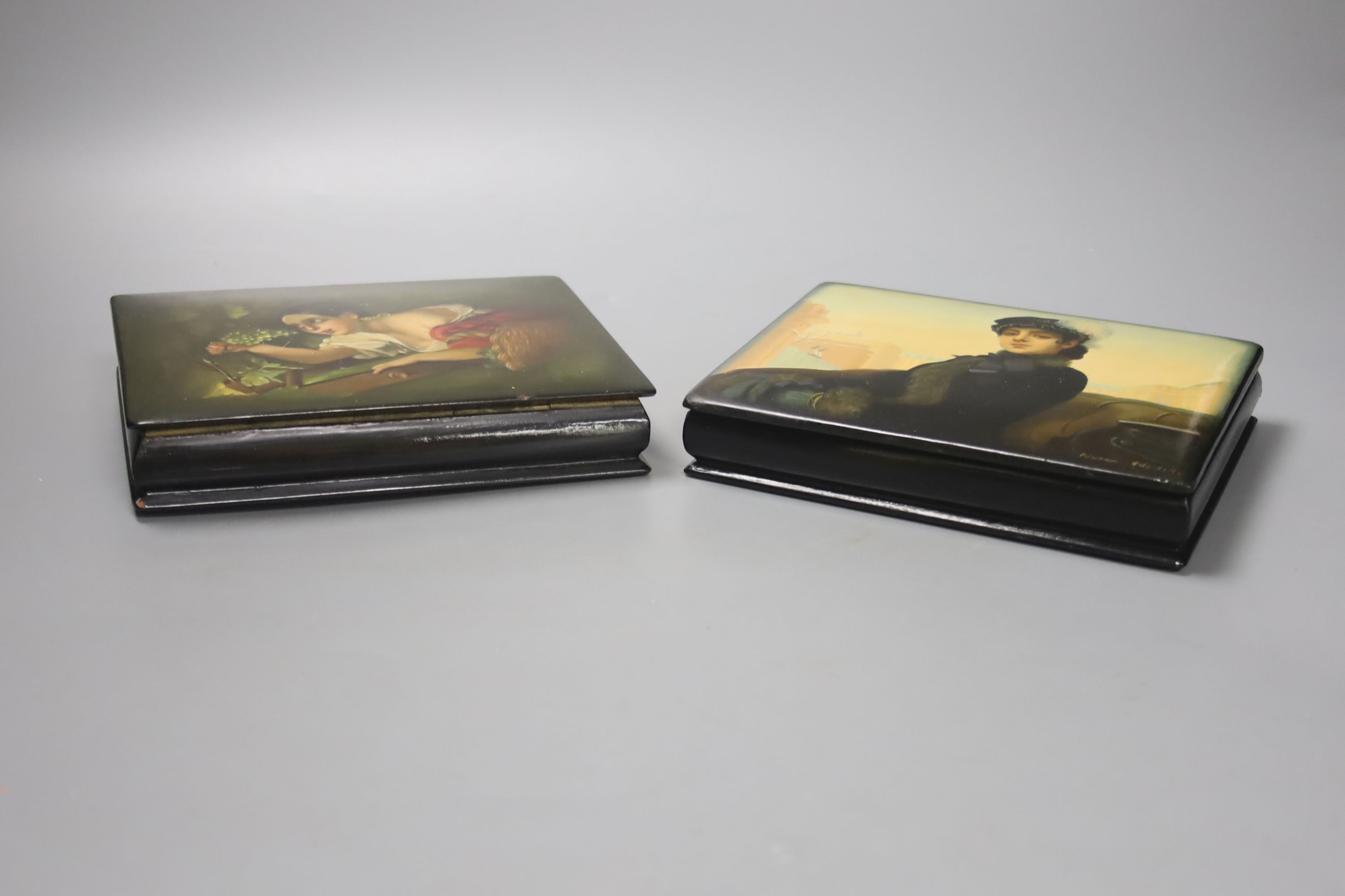 Two Russian papier mache boxes with hinged covers, each 17 x 13cm